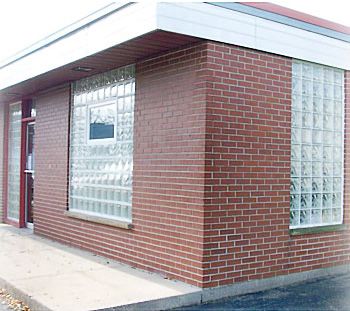 Multiple custom glass block window walls on a building