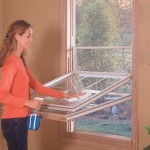 Woman Cleaning A Replacement Window